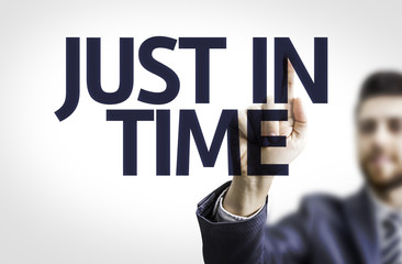 Business man pointing the text: Just In Time