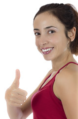 Smiling young woman giving thumbs up