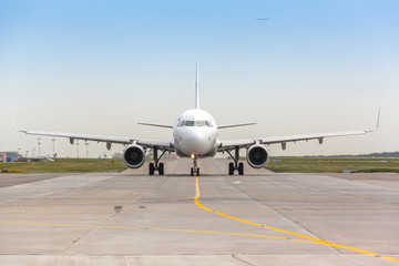 Fototapeta na wymiar White jet airplane on the runway