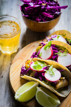 Fish tacoes on wooden background