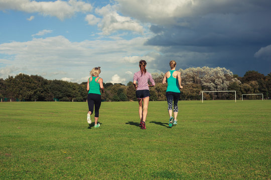 Three women running in the park