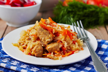 Uzbek national dish pilaf on plate