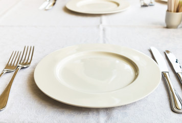 white empty plate on table