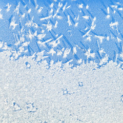 frost crystals close up on blue car hood