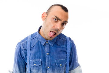 Obraz premium model isolated on plain background face sticking tongue out