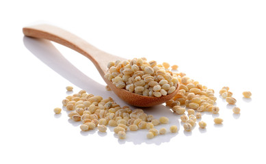 Job's tears with wooden spoon isolated on white