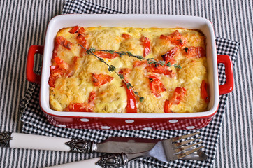 Vegetables with cheese crust in a ceramic baking dish