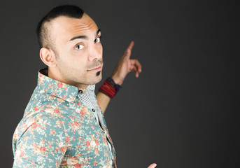 model isolated on plain background looking at camera pointing