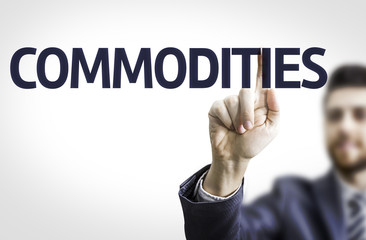 Business man pointing the text: Commodities