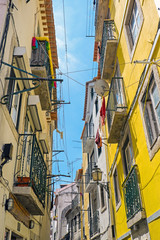 Small narrow street in the Alfama district in Lisbon, Portugal