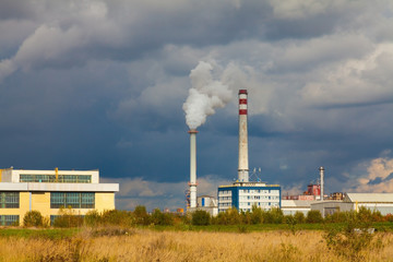 Fototapeta na wymiar Industrial power plant with smokestack