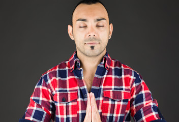 model isolated on plain background praying wishing