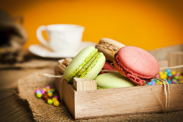 A lot of french colorful macarons with Turkish coffee