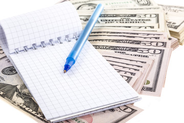 notebook on dollar background