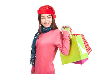 Asian girl with red christmas hat with shopping bags