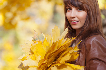 Beautiful autumn woman in golden park