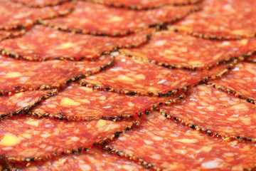 Black pepper-coated salami with cheese