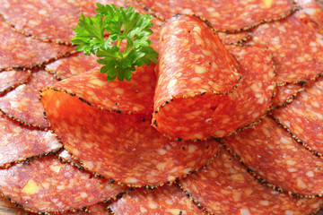 Black pepper-coated salami with cheese
