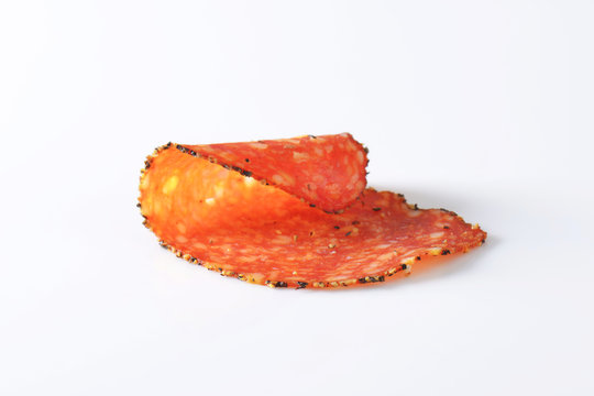 Black pepper-coated salami with cheese
