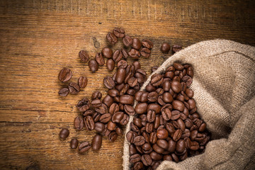 Coffee beans on grunge wooden background