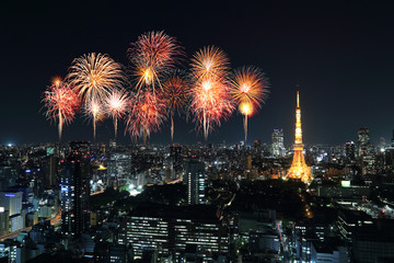 Fireworks celebrating over Tokyo cityscape at night