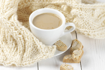 Coffee with cookies and knitwear