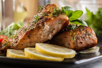 Fried salmon steak with vegetables