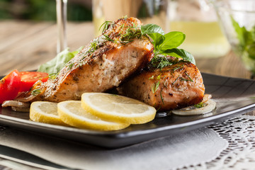 Fried salmon steak with vegetables