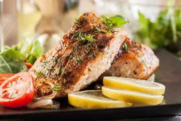 Fried salmon steak with vegetables