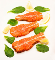 Red fish medallions on white background