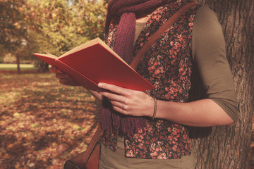 Young woman reading in the park