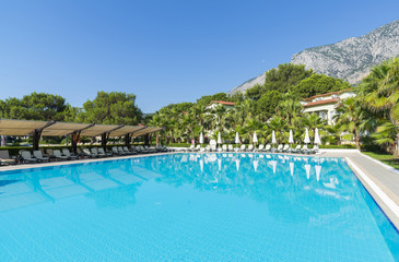 Swimming pool with water in open air