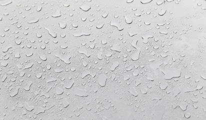 Metal surface covered in water drops.