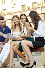 Interracial business team working at laptop in a office outdoor