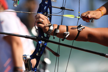 Bow and arrow in the hands of an archer