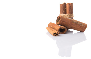 Cinnamon sticks over white background