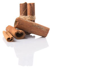 Cinnamon sticks over white background