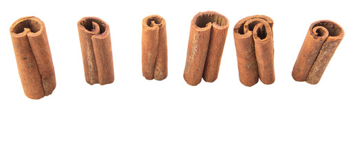 Cinnamon sticks over white background