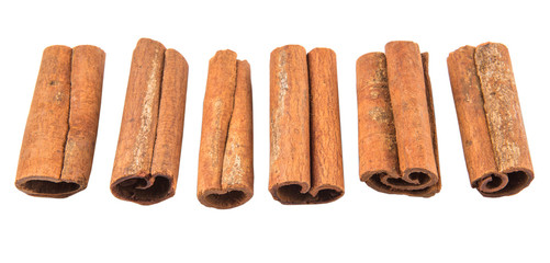 Cinnamon sticks over white background