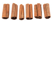 Cinnamon sticks over white background