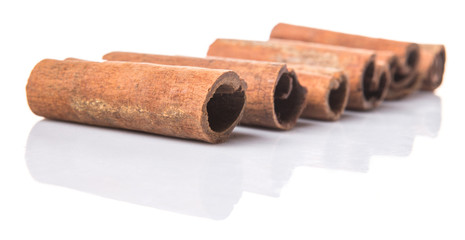 Cinnamon sticks over white background