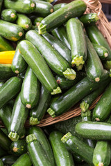 Fresh healthy green zucchini courgettes  on the marketplace