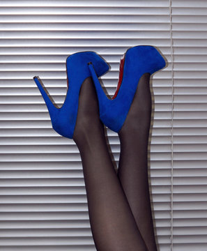 Beautiful female legs in capron and heels