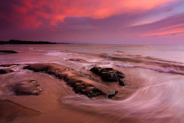 Waves and sunset at a beach in Sabah, East Malaysia, Borneo