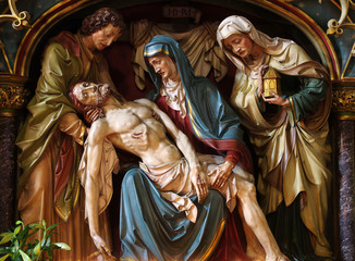 Virgin Mary cradling the dead body of Jesus,