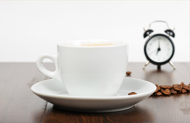 Breakfast with coffe and alarm clock