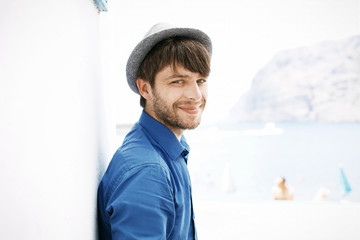 Cheerful and handsome guy with trendy hat