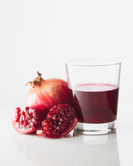 Pomegranate and glass of pomegranate juice