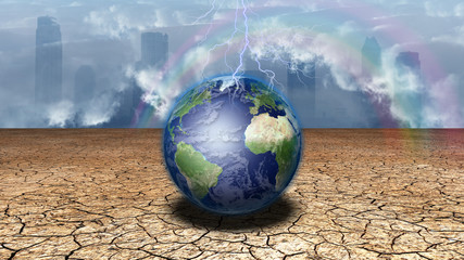 Earth sits in dried cracked mud before metropolis