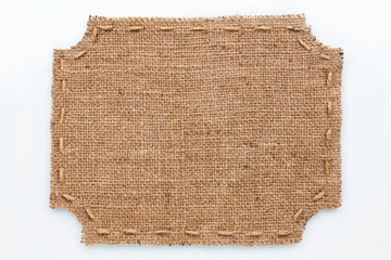 Frame of burlap, lies on a white background